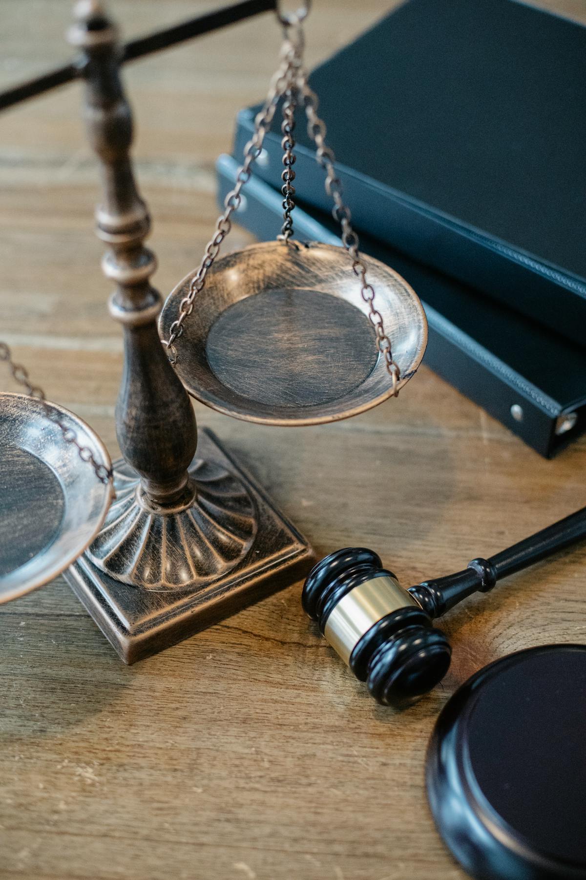 Legal scales of justice and gavel on a wood desk